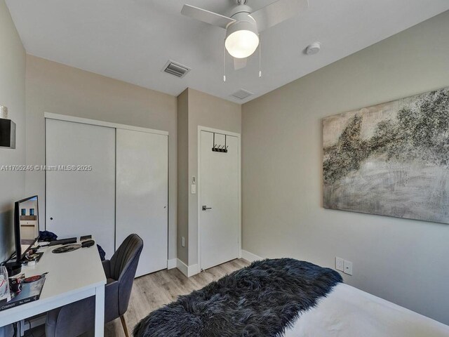 bedroom with ceiling fan and light wood-type flooring