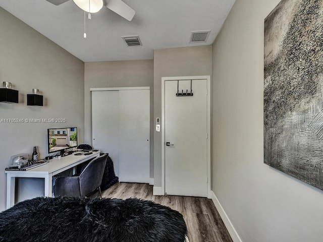 office with ceiling fan and light hardwood / wood-style floors