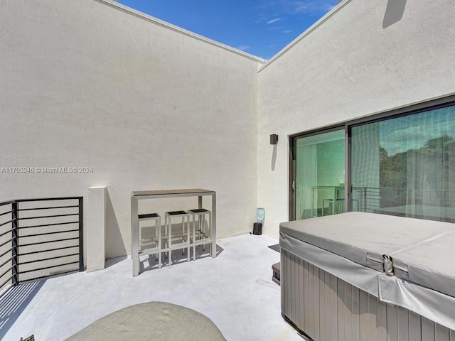 view of patio / terrace featuring a hot tub