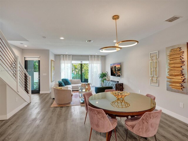 dining area with wood-type flooring