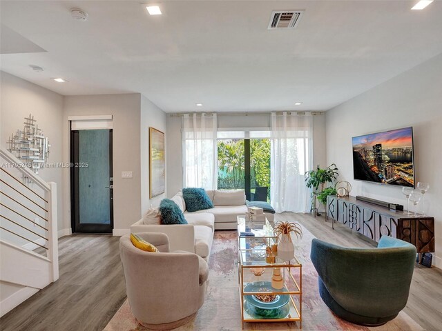 living room with light hardwood / wood-style flooring