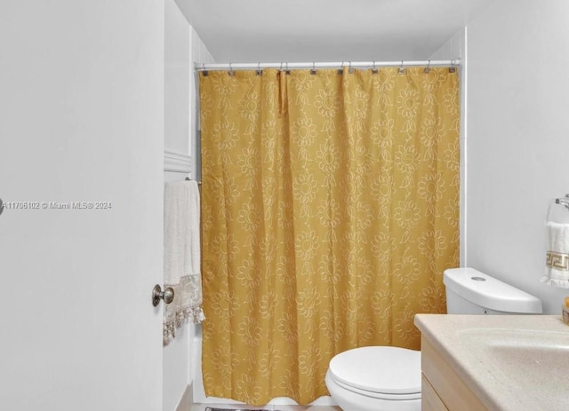 bathroom with vanity and toilet