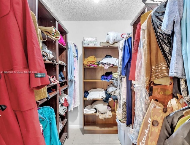 spacious closet with light tile patterned flooring