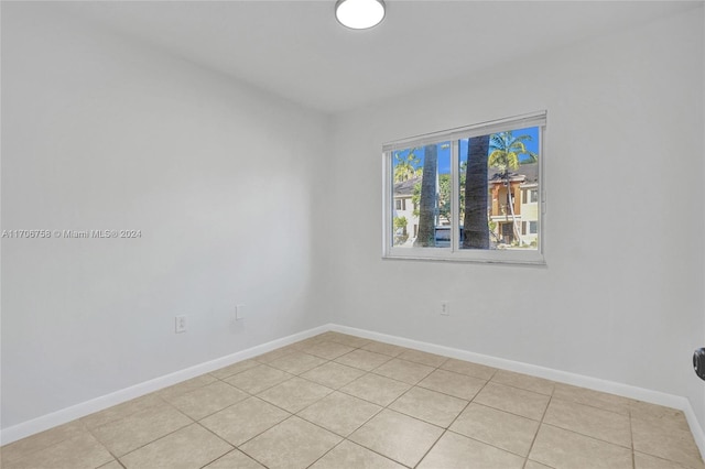 empty room with light tile patterned floors