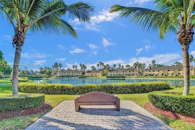 surrounding community featuring a water view