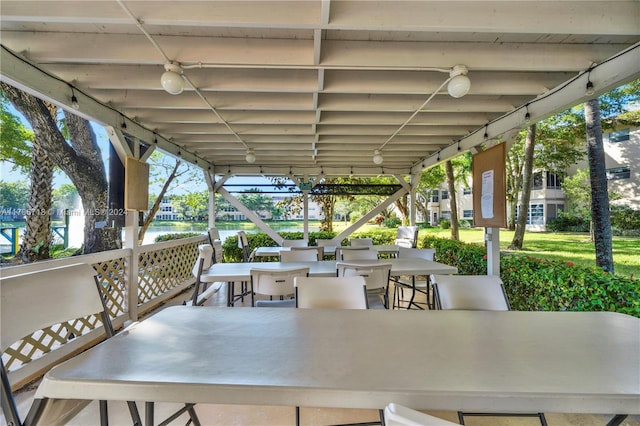 view of patio with a water view