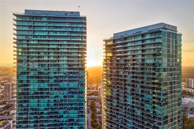 view of outdoor building at dusk