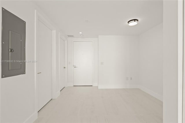 unfurnished room featuring electric panel