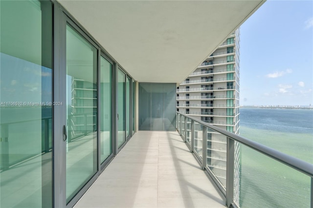 balcony featuring a water view