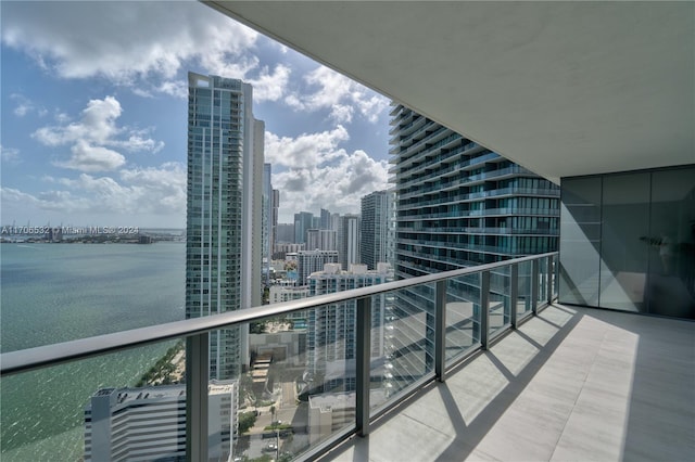 balcony featuring a water view