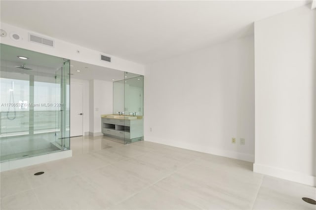 empty room with light tile patterned flooring