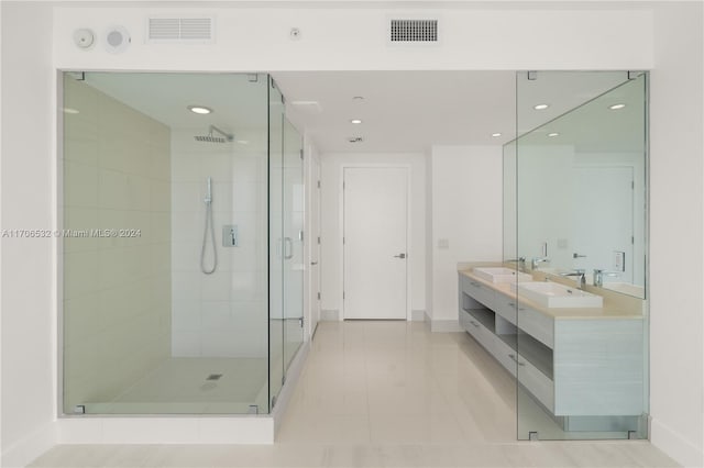 bathroom featuring tile patterned floors, vanity, and an enclosed shower