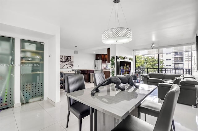 dining area featuring light tile patterned floors