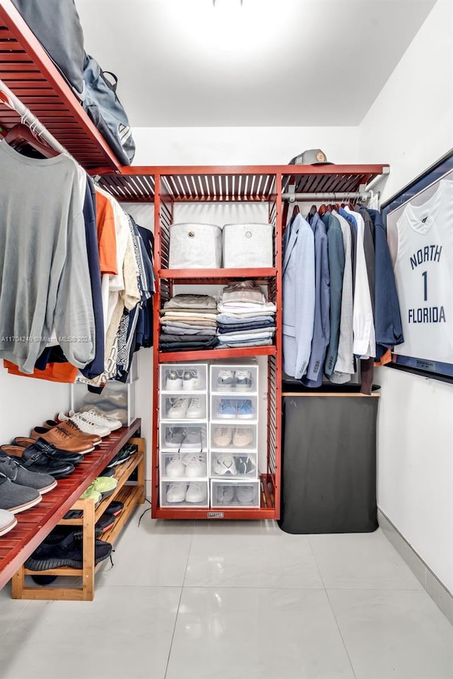 spacious closet featuring tile patterned flooring