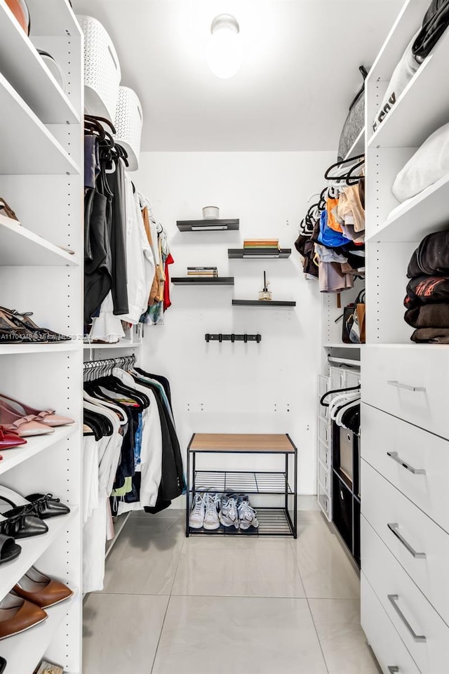 walk in closet featuring light tile patterned floors