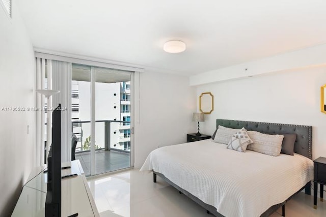 bedroom featuring access to exterior and expansive windows