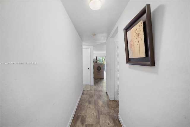 hall with hardwood / wood-style floors