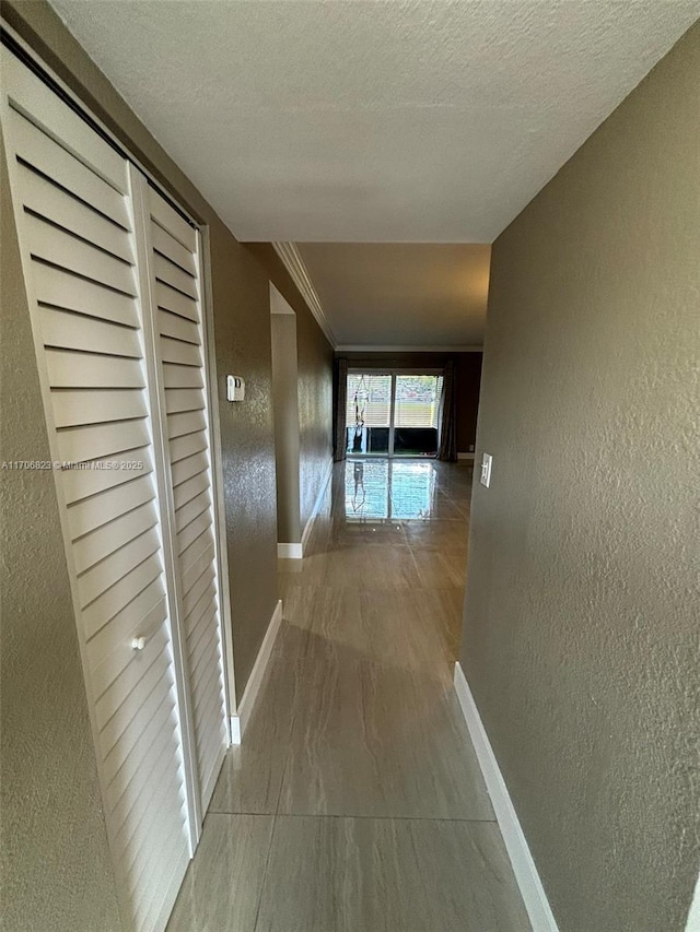 corridor with a textured ceiling