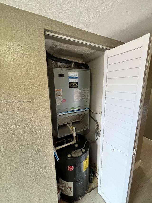 utility room with electric water heater