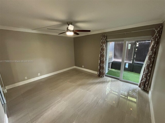 empty room featuring ceiling fan and ornamental molding