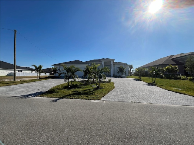 view of front of property with a front lawn