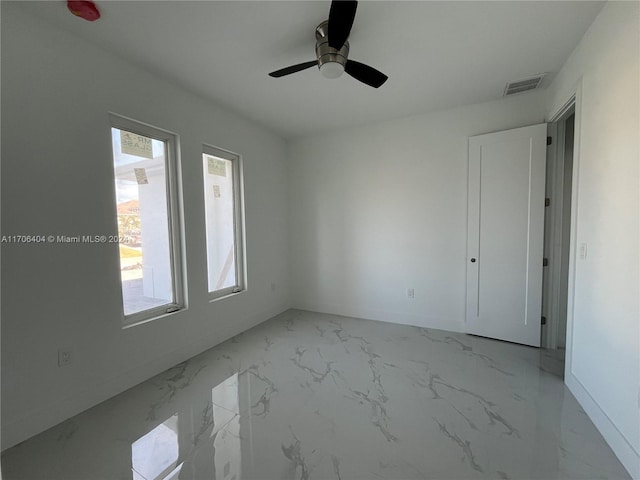 spare room featuring ceiling fan