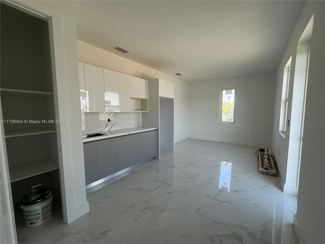 kitchen with white cabinetry