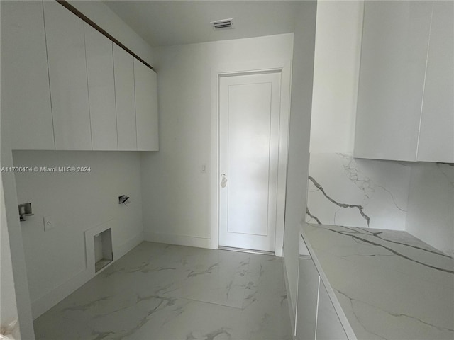 washroom featuring cabinets