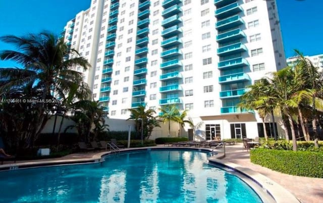 view of pool featuring a patio