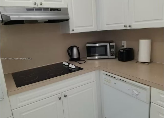 kitchen featuring ventilation hood, dishwasher, white cabinetry, and black electric cooktop