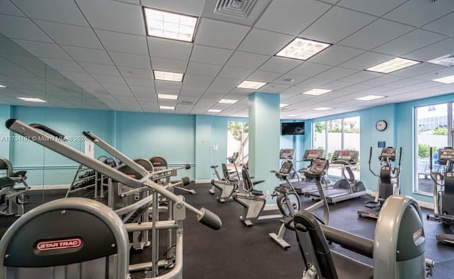 workout area with a drop ceiling