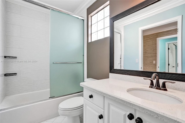 full bathroom with tile patterned flooring, bath / shower combo with glass door, toilet, vanity, and ornamental molding