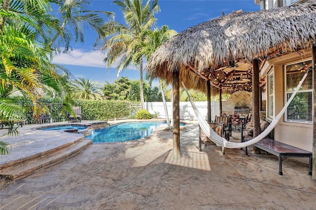 view of pool featuring a patio area and exterior kitchen