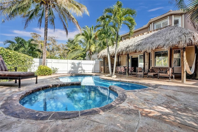 view of pool featuring an in ground hot tub and a patio