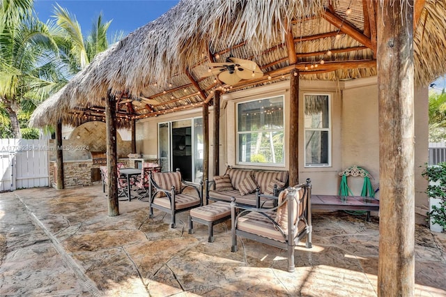 view of patio / terrace with a gazebo, an outdoor kitchen, and ceiling fan