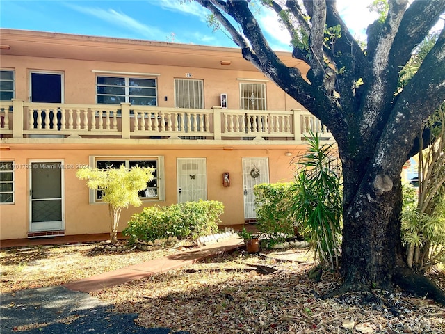 view of front of property with a balcony