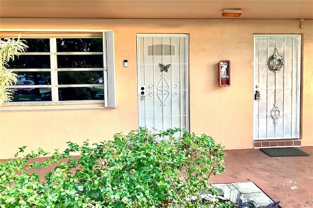 20275 NE 2nd Ave Unit 16, Miami, FL 33179 - property entrance with stucco siding