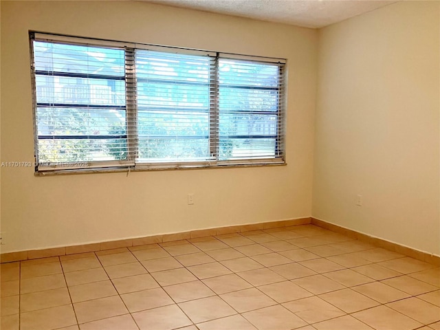 20275 NE 2nd Ave Unit 16, Miami, FL 33179 - unfurnished room with light tile patterned floors and baseboards