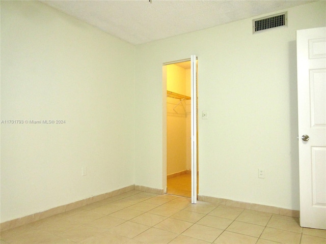 view of tiled spare room