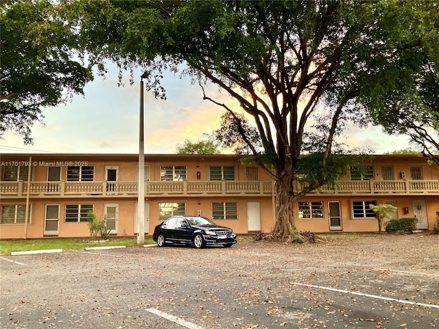 20275 NE 2nd Ave Unit 16, Miami, FL 33179 - property at dusk with uncovered parking