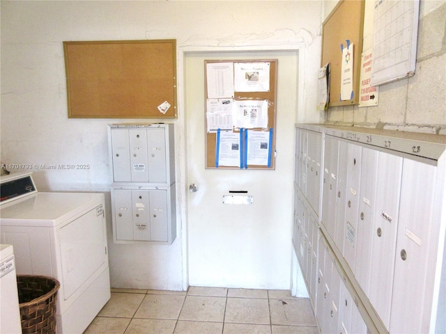 20275 NE 2nd Ave Unit 16, Miami, FL 33179 - laundry area featuring light tile patterned floors, washer and dryer, and mail area
