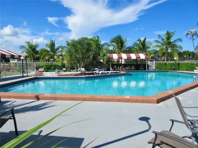 20275 NE 2nd Ave Unit 16, Miami, FL 33179 - community pool with fence and a patio area