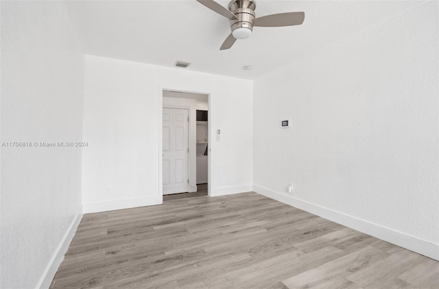 unfurnished room featuring ceiling fan and light wood-type flooring