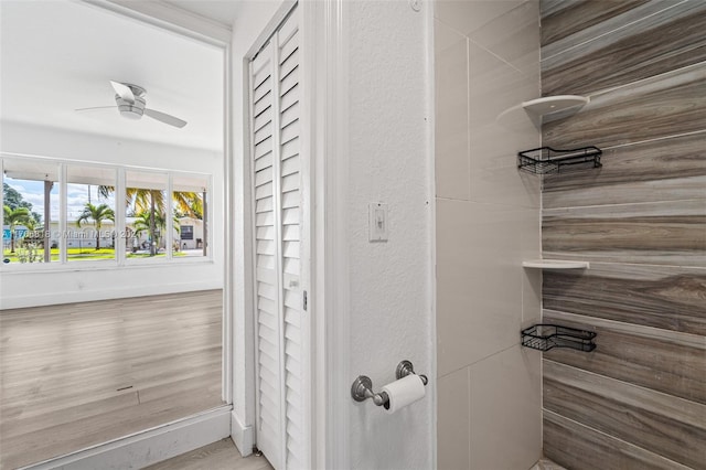 bathroom featuring ceiling fan and hardwood / wood-style flooring