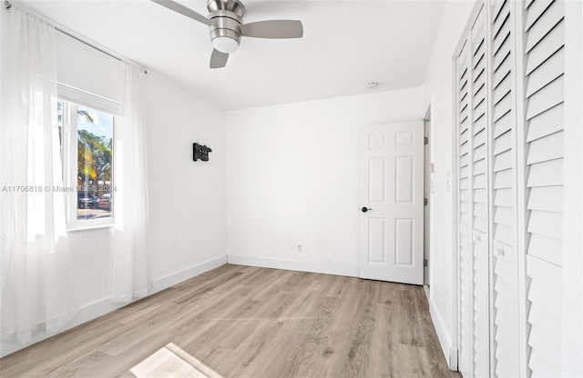 unfurnished room with ceiling fan and light hardwood / wood-style flooring