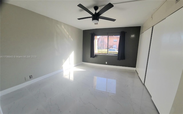 unfurnished room featuring ceiling fan