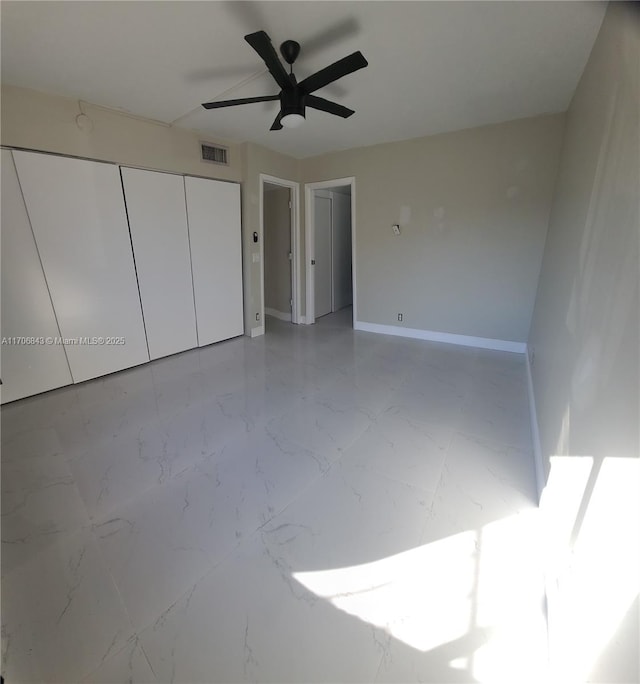 unfurnished bedroom featuring a closet and ceiling fan