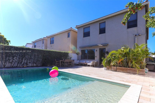 view of pool featuring a patio