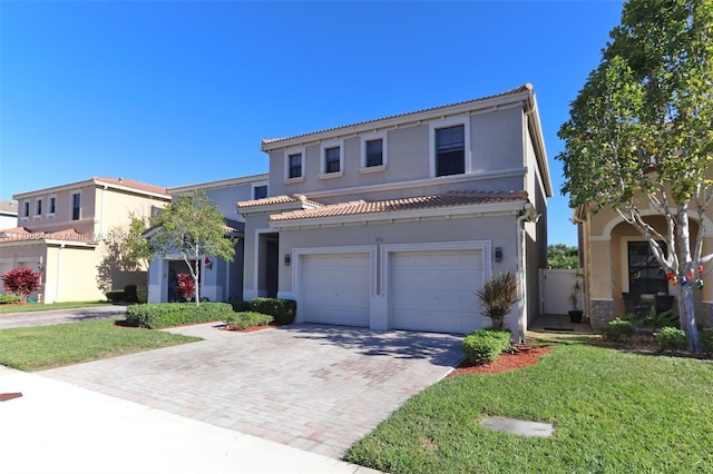 front facade featuring a front yard and a garage