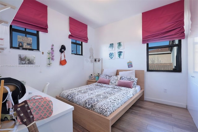 bedroom featuring hardwood / wood-style flooring